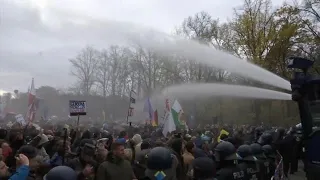 WATCH: German Police Fire Water Cannons at Virus Protesters in Berlin