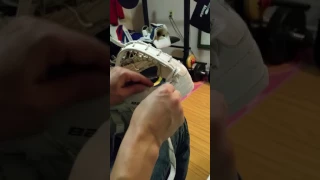 Relacing a goalie glove with skate lace