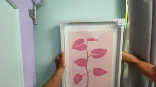 How to hang a 2 pictures with wire evenly