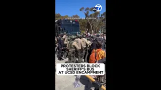 Protesters block sheriff's bus at UCSD encampment