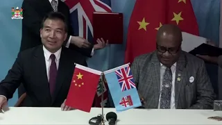 Acting Prime Minister officiates at the signing ceremony with the China International Aid Agency
