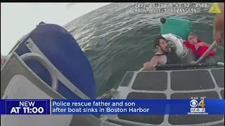 Police rescue father and son from Boston Harbor after boat sank