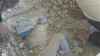 A Child Is Pulled Alive From the Rubble in Syria