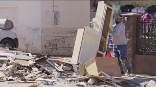 Volunteers, city crews in southeast San Diego help homeowners recover from flood damage