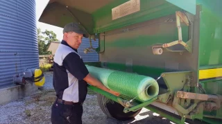 Loading NetWrap in a John Deere Baler