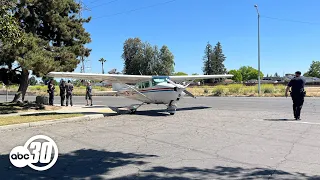 Plane carrying banner lands on northwest Fresno street