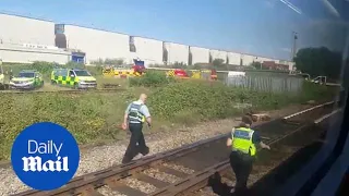 Emergency services arrive after two rail workers killed by train