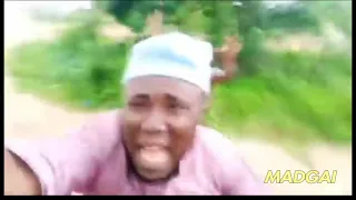 african guy running away from tribe member but with sponge bob music