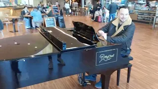 Michał Cholewiński plays Chuck Berry you never can tell & Boogie Woogie medly  at Bergamo Airport.