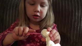 Abigail un-boxing her birthday present, Disney princess rapunzel snow globe/glitter dome.