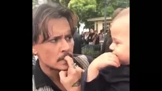 Johnny Depp being adorable with a baby @ Disneyland Paris (PotC: Dead Men Tell No Tales premiere)