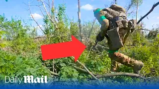 Bullets zip past Ukrainian soldiers' heads as they storm Russia trenches near Bakhmut in POV footage