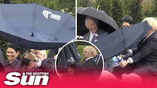 Boris struggles with an umbrella