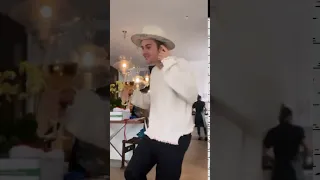 Justin Bieber dancing with a wine glass