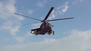 Mil Mi - 24 "Hind" chopper  makes scary low flight on tourist crowded beach!