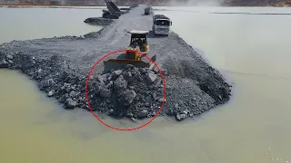 The Best Techniques Build Road Cross the Water With Operator Bulldozer Push Stone, Dump Truck