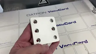 Datron Neo Cuts Optomechanical Part Using Vacuum Table