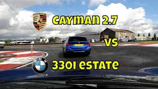 Porsche Cayman 987 vs BMW 330i Touring on track at Bedford Autodrome