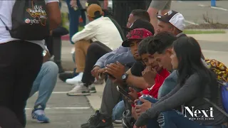 Migrants new to Denver sleep in parking garage waiting for assistance