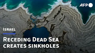 Sinkholes emerge with the 'unstoppable' receding of the Dead Sea | AFP