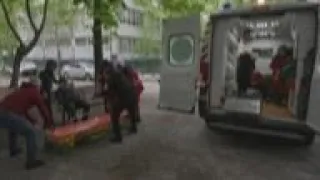 Kharkiv emergency crews help injured, remove body