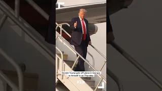Donald Trump arrives in Georgia to surrender on charges he sought to overturn his 2020 loss