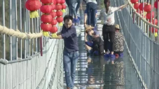 Raw  Tourists Brave Glass Bottom Bridge   YouTube