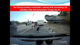 Terrifying moment motorbike crashes with oncoming car sending rider and passenger flying into air