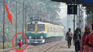 A Stupid & Careless Boy Crossing Rail Track in Front of Sea Green Running EMU Train | Risky Crossing