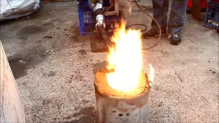 Melting soda cans and aluminium in furnace made from dirt Waste oil fueled