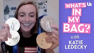 Katie Ledecky Shows Off Olympic Medals, Chocolate Milk, & More Items In Her Swim Bag