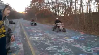 wheelies and drag racing at Centralia's graffiti highway