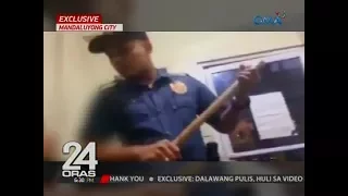 24 Oras Exclusive: Mga lumabag sa barangay ordinance, pinaghahampas at tinutukan ng baril ng 2 pulis