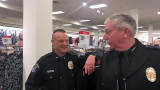 Law enforcement officers  help these Tri-City 'Youths of the Year' dress for success