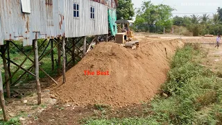 The Bulldozer Pushing Soil 5times 25 to fill the safety ground By Mini Dump Truck 5Ton and soil