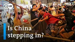 China's central government threatens Hong Kong protesters | DW News