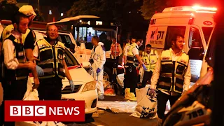 Manhunt for Palestinian axe attackers who killed three in Israel - BBC News