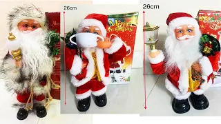 ông già noel đeo khẩu trang, cầm đèn   nhảy múa phát tiếng nói, tiếng nhạc mừng giáng sinh