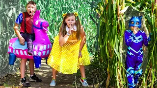 Assistant Gabby Gabby and Batboy Ryan Hunt for PJ Masks in a Corn Maze