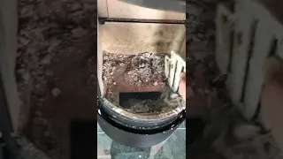 Removing the ash from Hwam stove