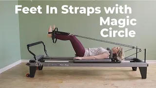 Feet in Straps with the Magic Circle on the Pilates Reformer