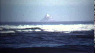 1971: Magic island floating above ocean in near fata morgana mirage. ASTORIA, OREGON