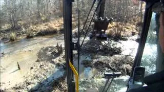 Excavator Busting Beaver Dams