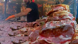 Juicy Pork Loin, Ribs and More Mixed Meat on Huge Grill. Italy Street Food