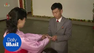 North Korean residents cast ballots for the state's parliament