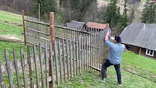 A boy builds a house for the Chickens for the summer to protect them from wild animals