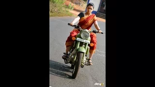 Beautiful actress Charmee rides bullet wearing saree