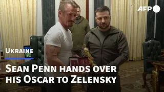American actor Sean Penn hands over his Oscar statuette to Zelensky | AFP