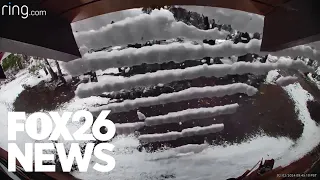 Snow falls off cabin roof in satisfying way in Central California mountains