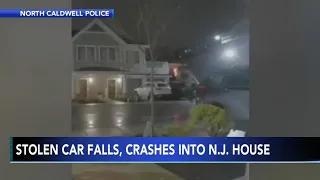 Caught on video: Stolen car goes airborne, crashes into home